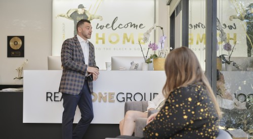 Agent talking at office with client 