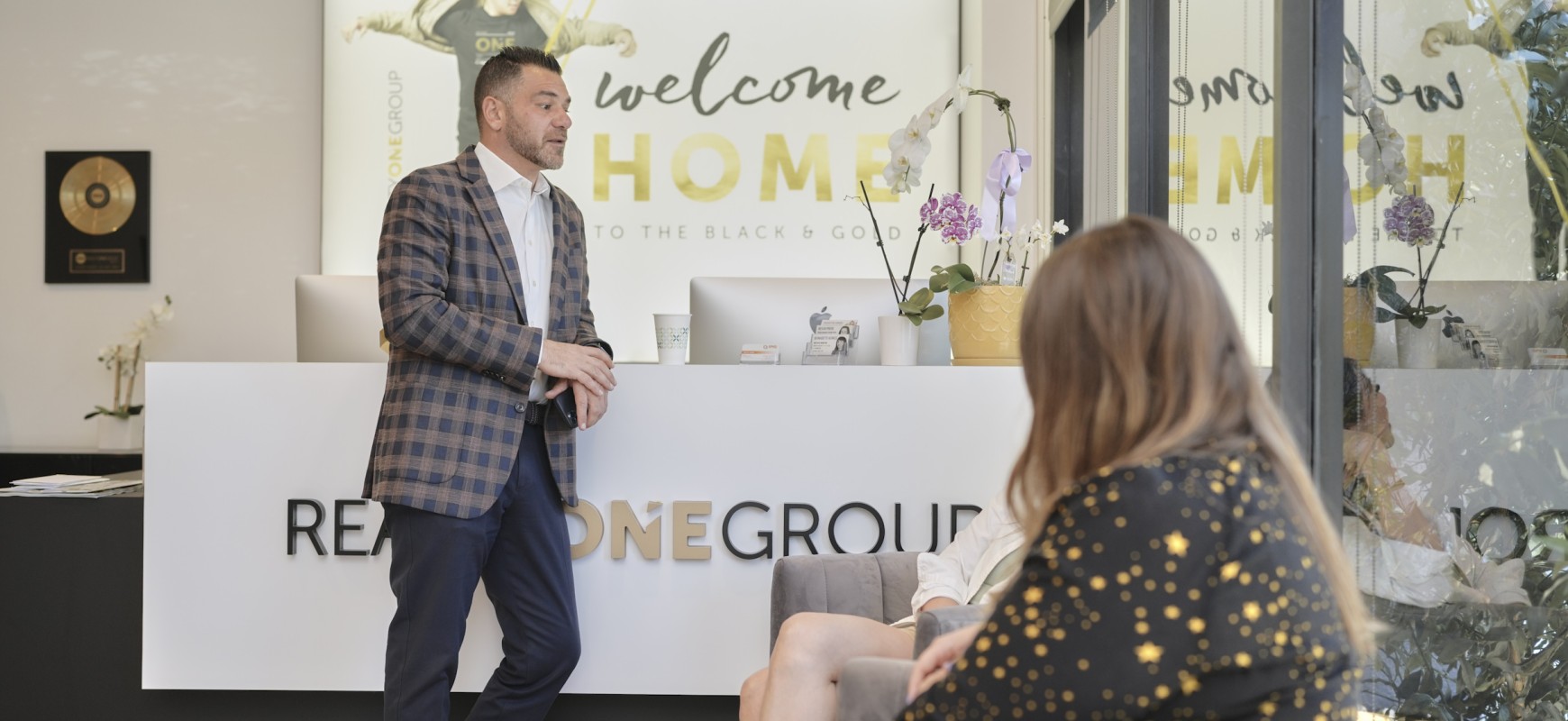 Agent talking at office with client